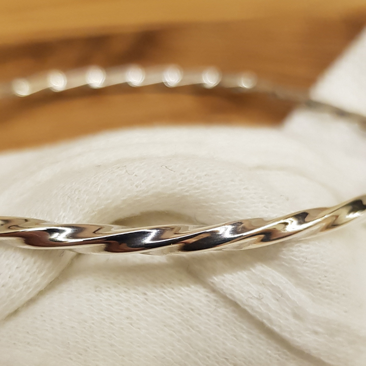 This Beautiful Silver Twist Bangle is a 3mm wide rounded design in 925 twisted silver work with a high polish and looks amazing. The 925 Silver Twist Bangle is designed to be worn on it's own or added to in multiples. It is 65mm round and slides nicely over the hand.