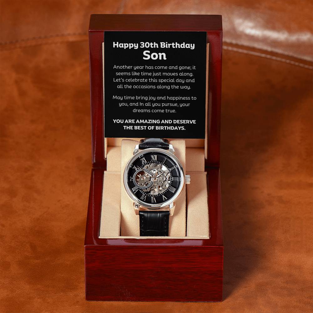 This see through mechanical watch and leather strap is crafted to be automatically wound up. Comes with Happy 30th Birthday message Son.