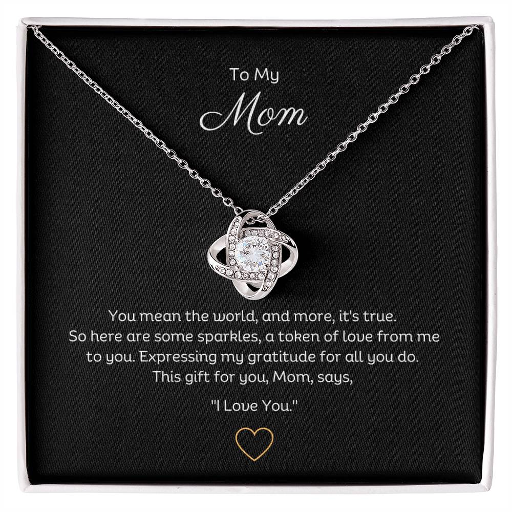 To My Mom, Beautiful Love Knot 14k or 18k finish Necklace. Features a beautiful pendant embellished with premium cubic zirconia crystals.