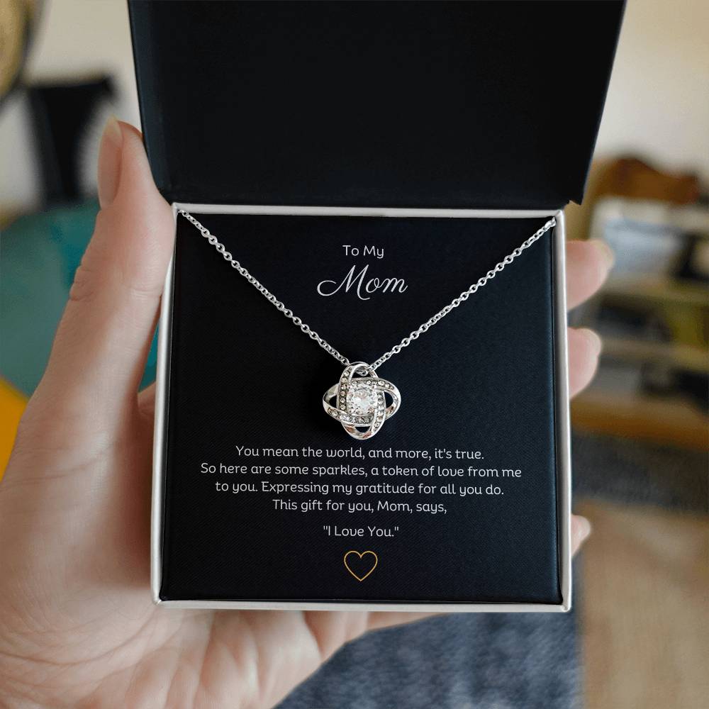 To My Mom, Beautiful Love Knot 14k or 18k finish Necklace. Features a beautiful pendant embellished with premium cubic zirconia crystals.