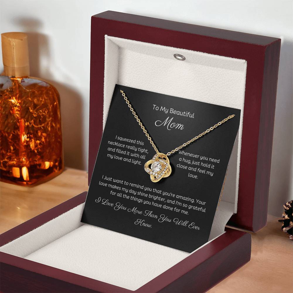 To My Mom, Beautiful Love Knot 14k or 18k finish Necklace. Features a beautiful pendant embellished with premium cubic zirconia crystals and heartfelt message card.