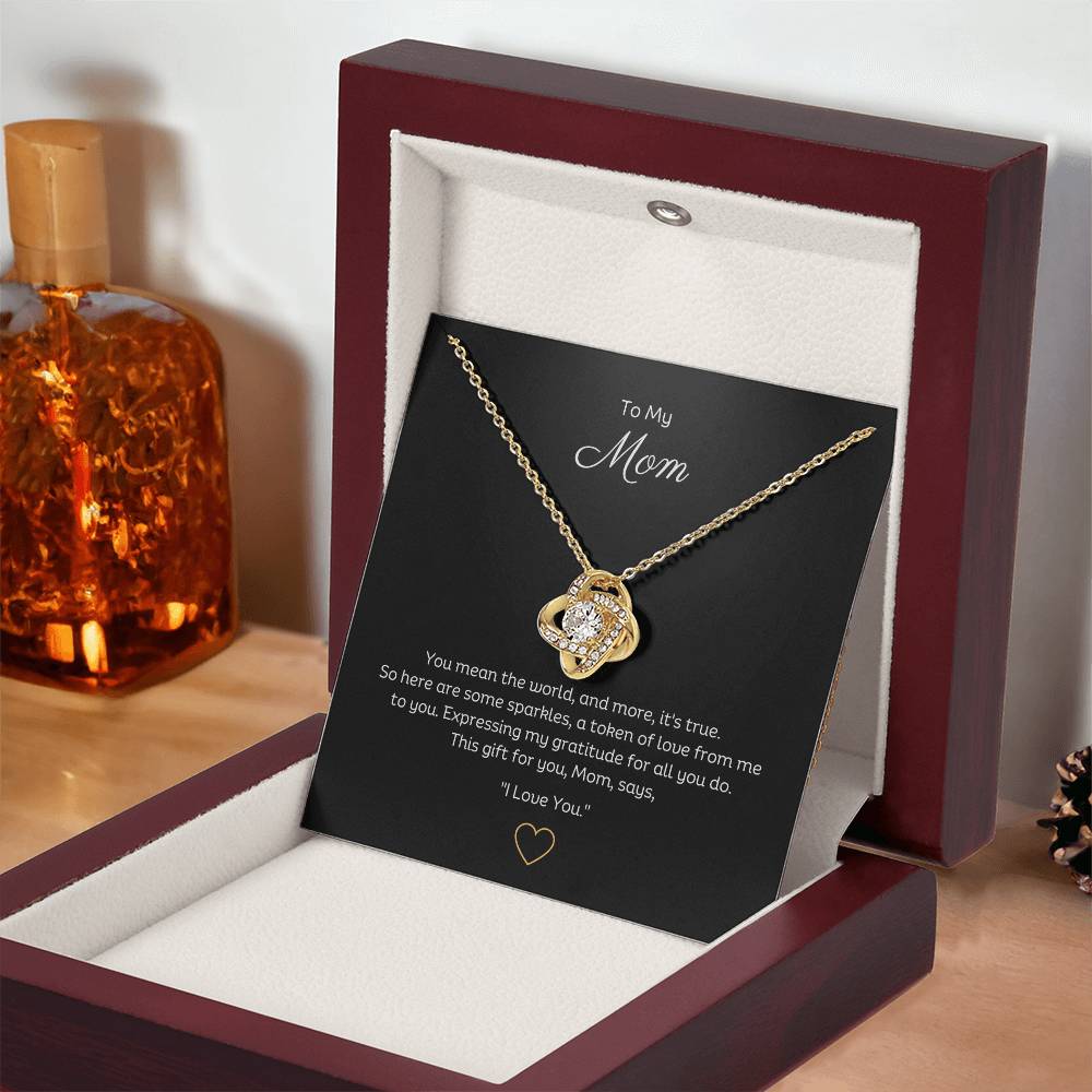 To My Mom, Beautiful Love Knot 14k or 18k finish Necklace. Features a beautiful pendant embellished with premium cubic zirconia crystals.