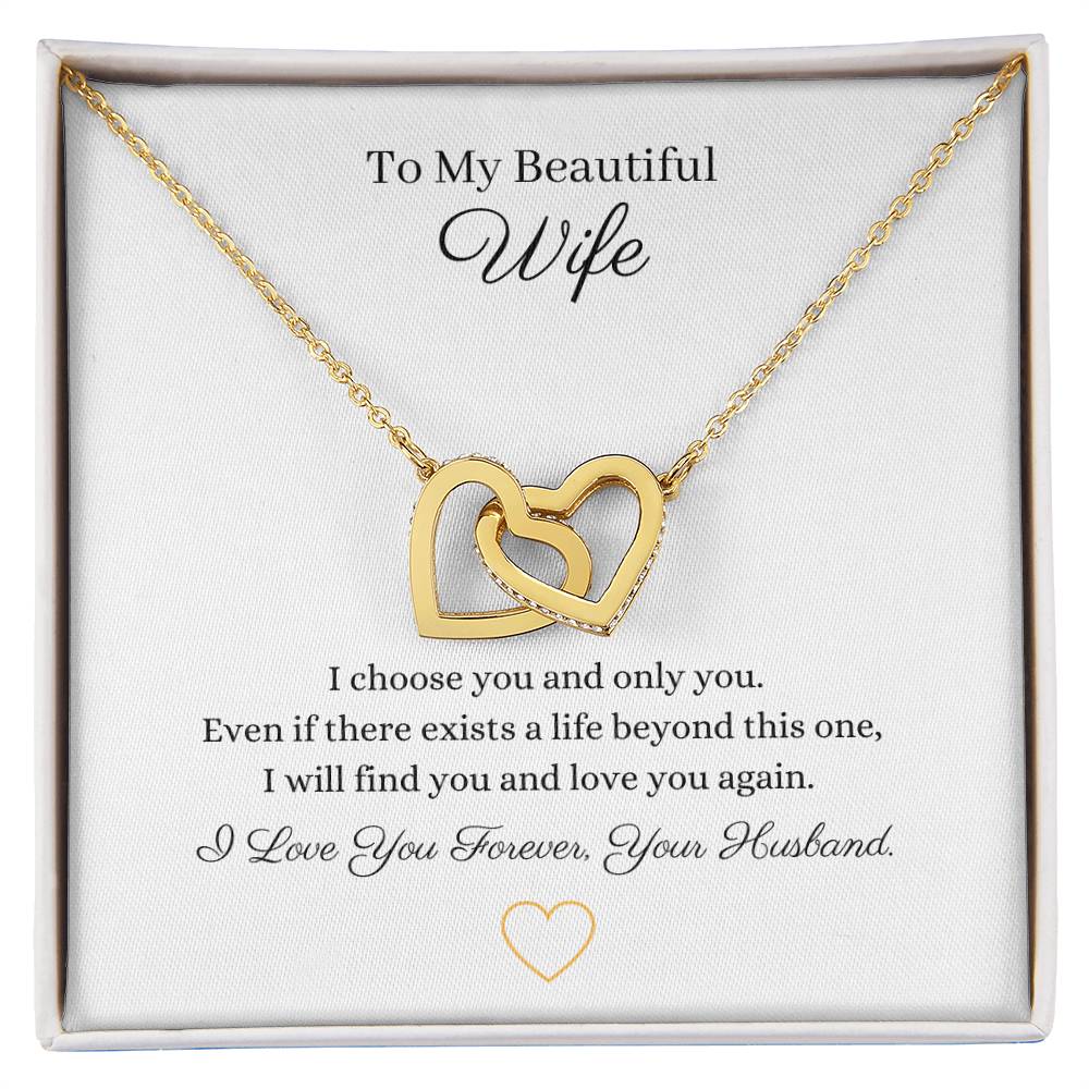 Two lovely interlocking heart pendants embellished with CZ crystals. High quality polished surgical steel and rose gold finish or 18k yellow gold finish necklace.