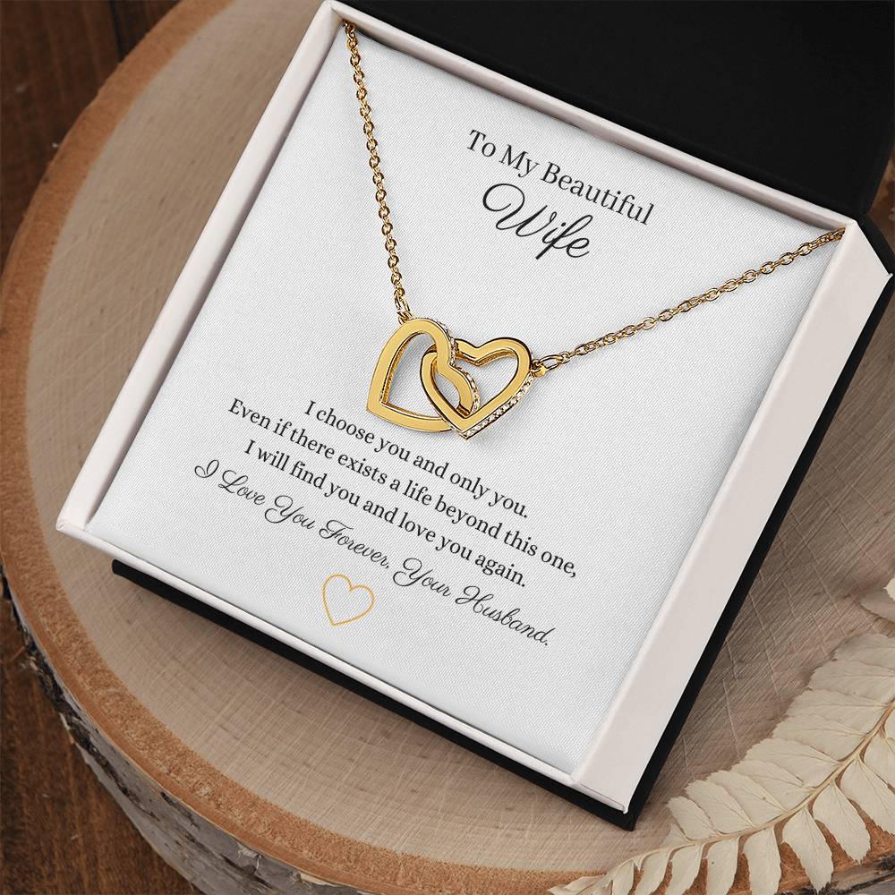 Two lovely interlocking heart pendants embellished with CZ crystals. High quality polished surgical steel and rose gold finish or 18k yellow gold finish necklace.