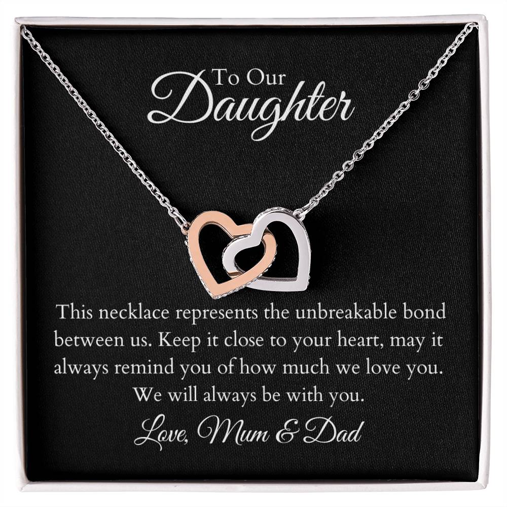 To Our Daughter, two lovely interlocking heart pendants embellished with CZ crystals. High quality polished surgical steel and rose gold finish.