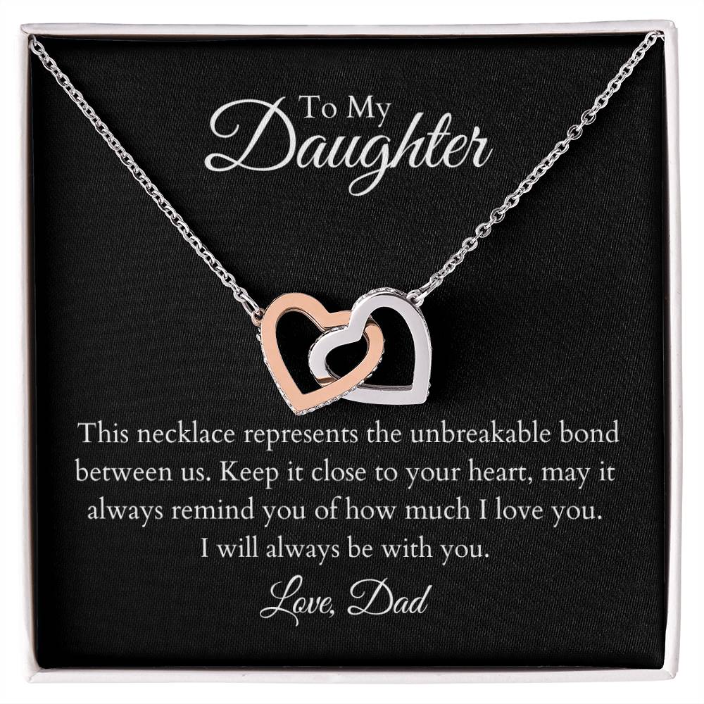 To My Daughter, two lovely interlocking heart pendants embellished with CZ crystals. High quality polished surgical steel and rose gold finish.