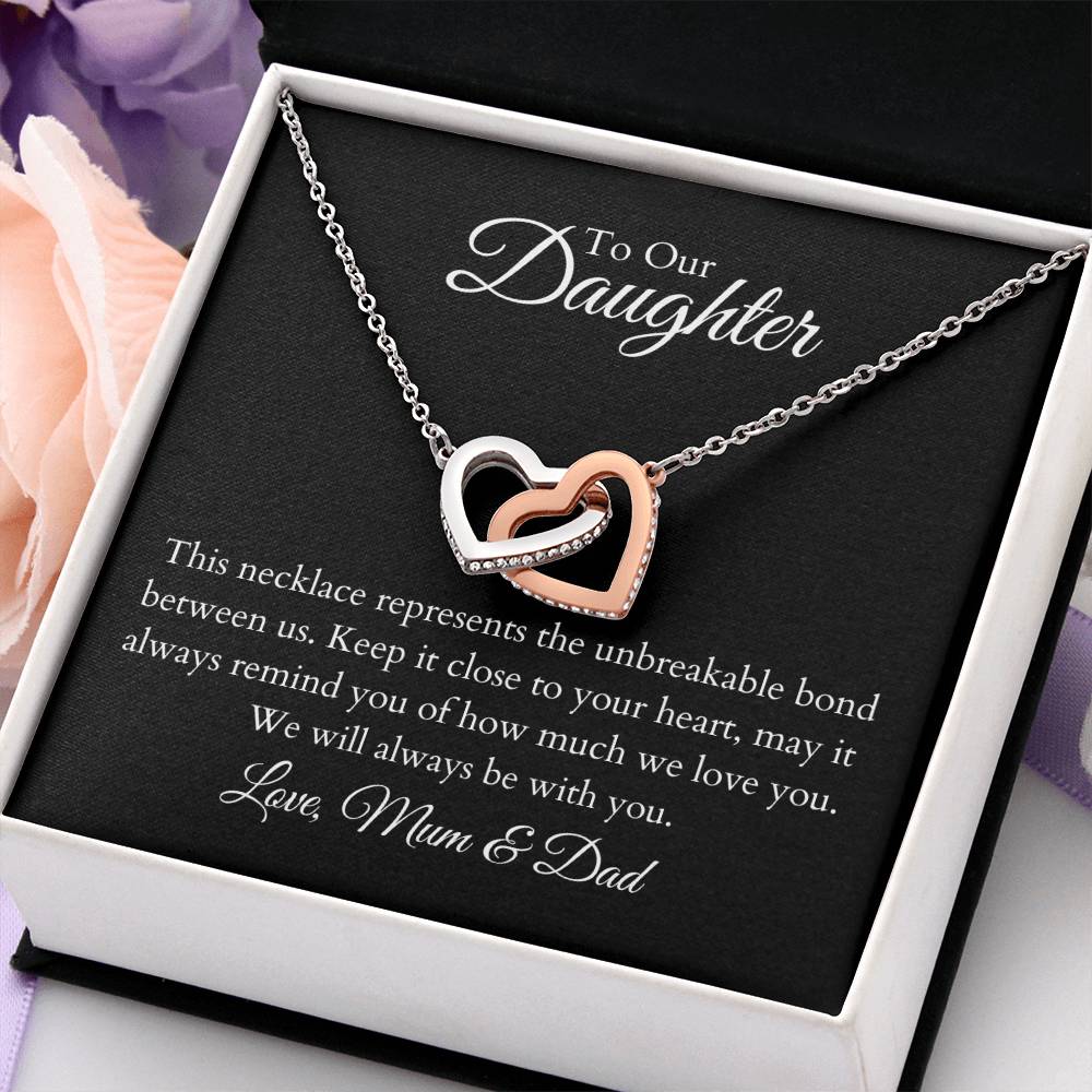 To Our Daughter, two lovely interlocking heart pendants embellished with CZ crystals. High quality polished surgical steel and rose gold finish.