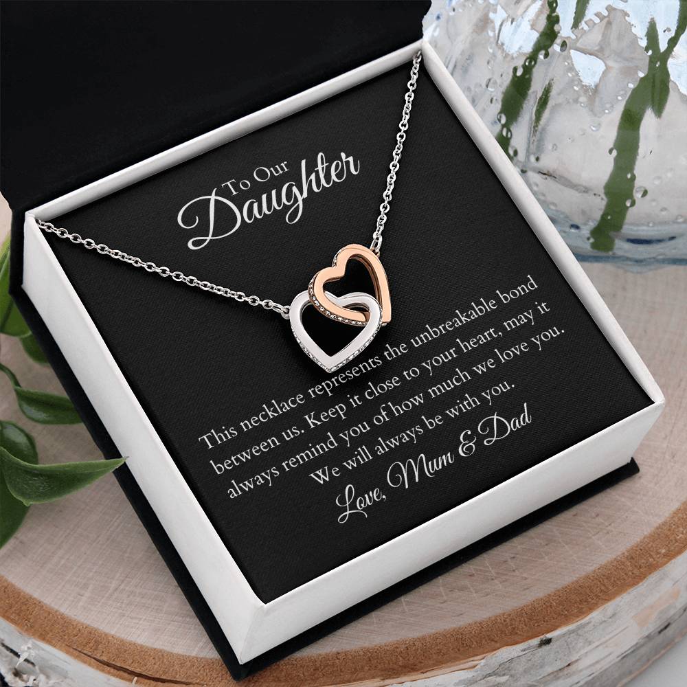 To Our Daughter, two lovely interlocking heart pendants embellished with CZ crystals. High quality polished surgical steel and rose gold finish.