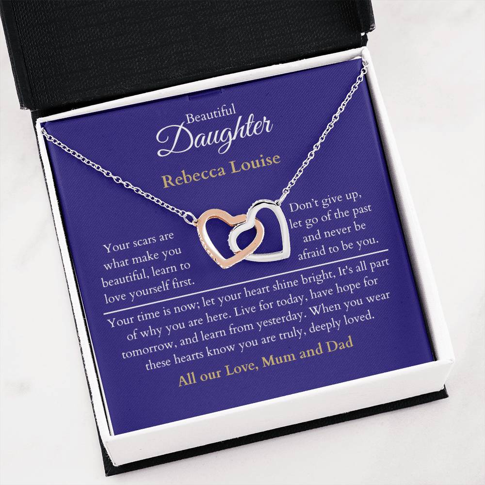 Personalised Beautiful Daughter Interlocking Hearts Necklace, two heart pendants embellished with CZ crystals High quality polished surgical steel and rose gold finish. With a Heartfelt message starting with: Your scars are what make you beautiful.