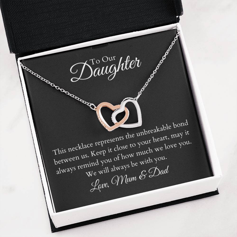 To Our Daughter, two lovely interlocking heart pendants embellished with CZ crystals. High quality polished surgical steel and rose gold finish.