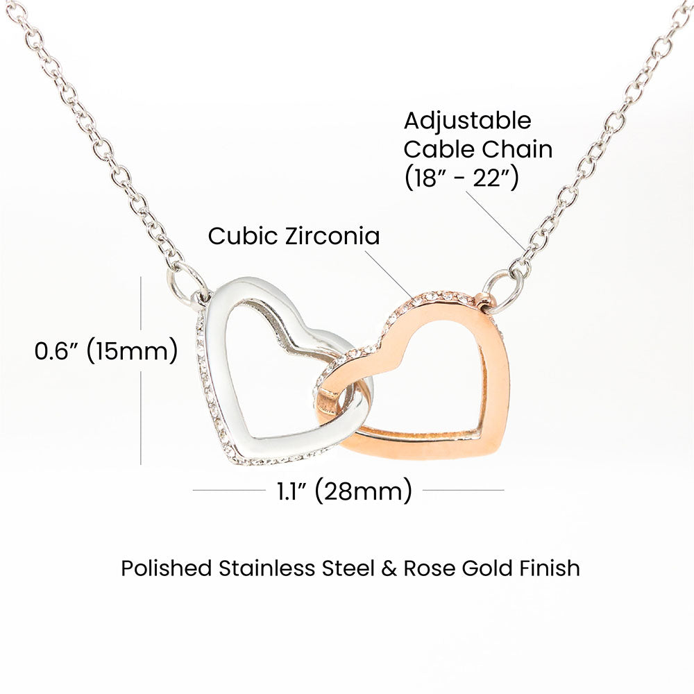 To My Daughter, two lovely interlocking heart pendants embellished with CZ crystals. High quality polished surgical steel and rose gold finish.