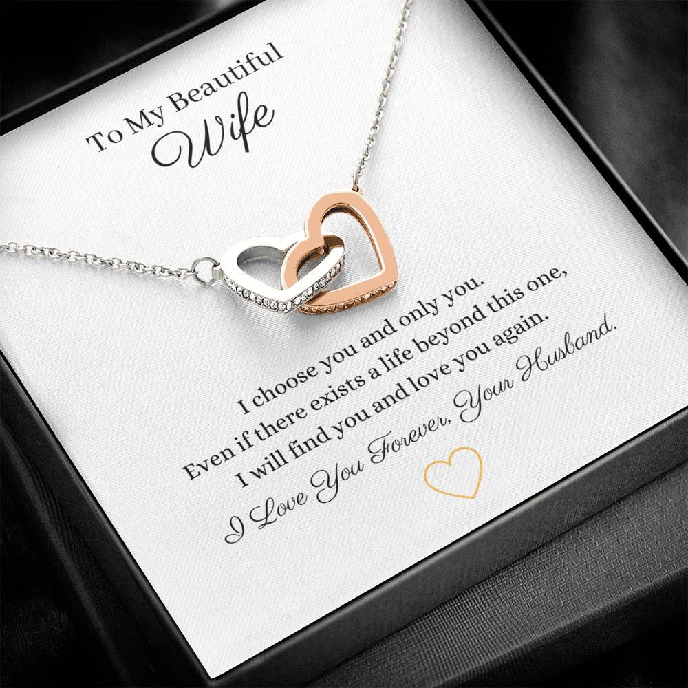 Two lovely interlocking heart pendants embellished with CZ crystals. High quality polished surgical steel and rose gold finish or 18k yellow gold finish necklace.