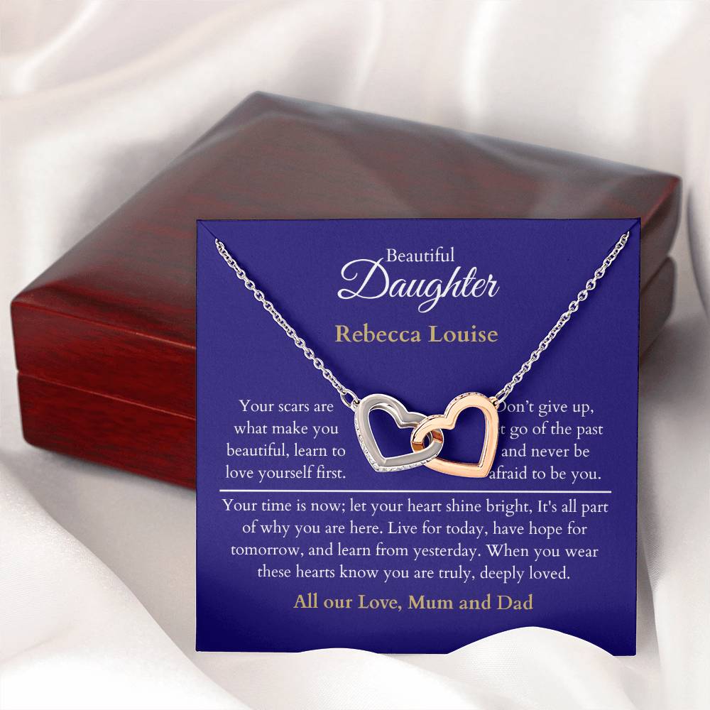 Personalised Beautiful Daughter Interlocking Hearts Necklace, two heart pendants embellished with CZ crystals High quality polished surgical steel and rose gold finish. With a Heartfelt message starting with: Your scars are what make you beautiful.