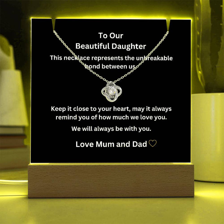 A stunning Square Acrylic and the beautiful Love Knot Necklace. The heartfelt message is showcased on crystal-clear acrylic, making this set a striking focal point in any space. Paired with the charming Love Knot Necklace.