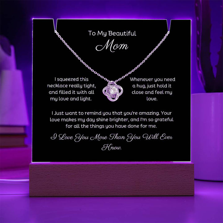 A stunning Square Acrylic and the beautiful Love Knot Necklace for Mom. The beautiful wife heartfelt message is showcased on crystal-clear acrylic, making this set a striking focal point in any space. Paired with the charming Love Knot Necklace.