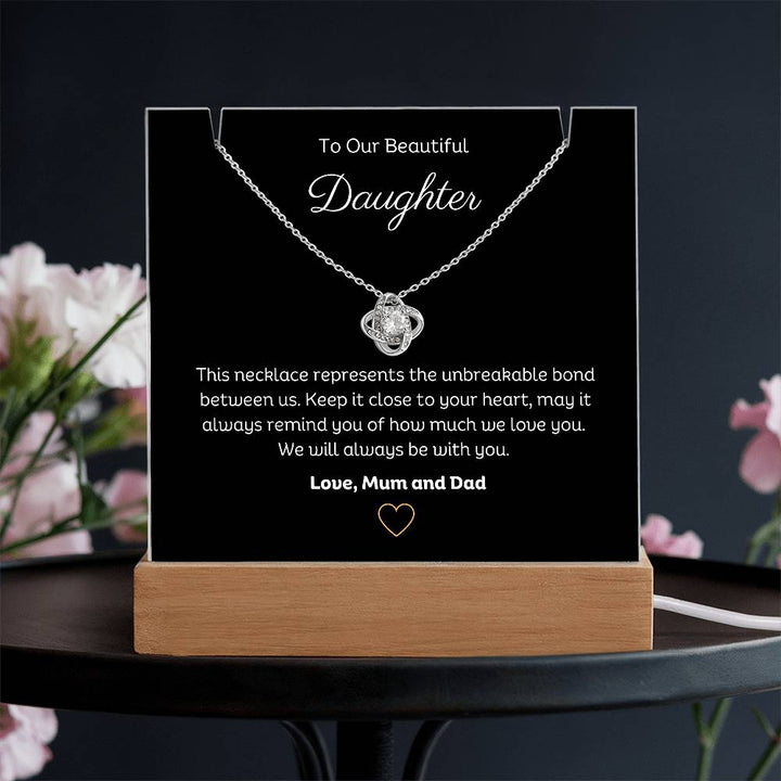 A stunning Square Acrylic and the beautiful Love Knot Necklace for Daughter. The heartfelt message is showcased on crystal-clear acrylic, making this set a striking focal point in any space. Paired with the charming Love Knot Necklace.