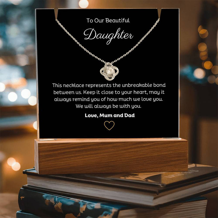 A stunning Square Acrylic and the beautiful Love Knot Necklace for Daughter. The heartfelt message is showcased on crystal-clear acrylic, making this set a striking focal point in any space. Paired with the charming Love Knot Necklace.