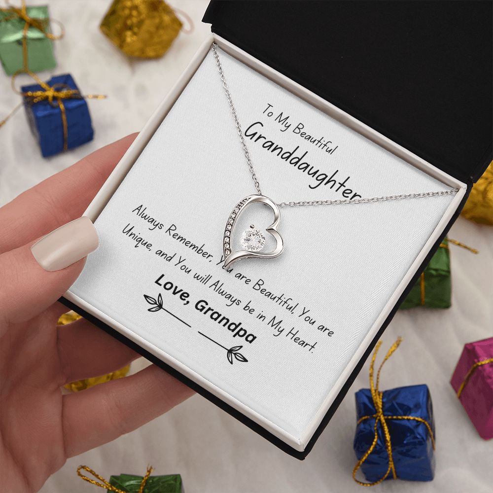 Beautiful heart necklace with either 14k white gold finish or 18k yellow gold finish and 6.5mm round cut cubic zirconia stone Pendant